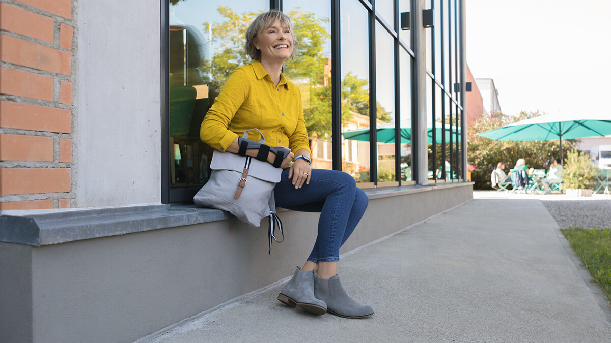 A woman is wearing a wrist brace