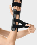 Fastening straps with micro touch fasteners Palmar Xtec Rhizo wrist orthosis being fastened with micro touch fasteners