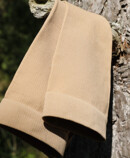 Juzo Adventure stocking in sesame hanging over a branch